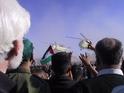 Height of excitement: the helicopter with the coffin of Yasser Arafat on board touching down