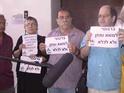 Gush Shalom activists demonstrate in the court