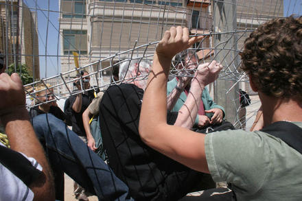 Avnery passes through the breach in the fence 