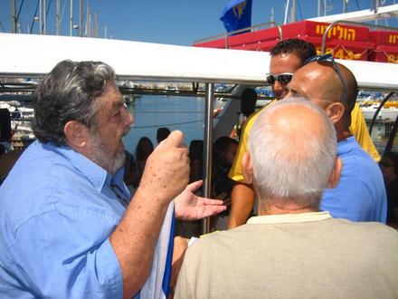 Naftali Raz, one of the organizers, in heated debate with the captain