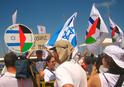 Israeli and Gush Shalom flags at the protest