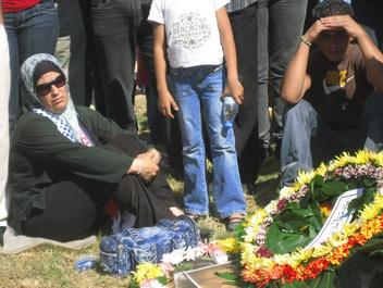 Grieve-stricken at the graveside