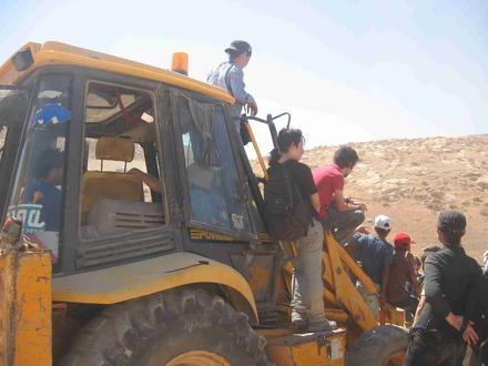 Protecting the bulldozer with our bodies