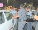Policemen rescue Avnery (in the car) from the rightist attackers (photo: Ofer Amram)